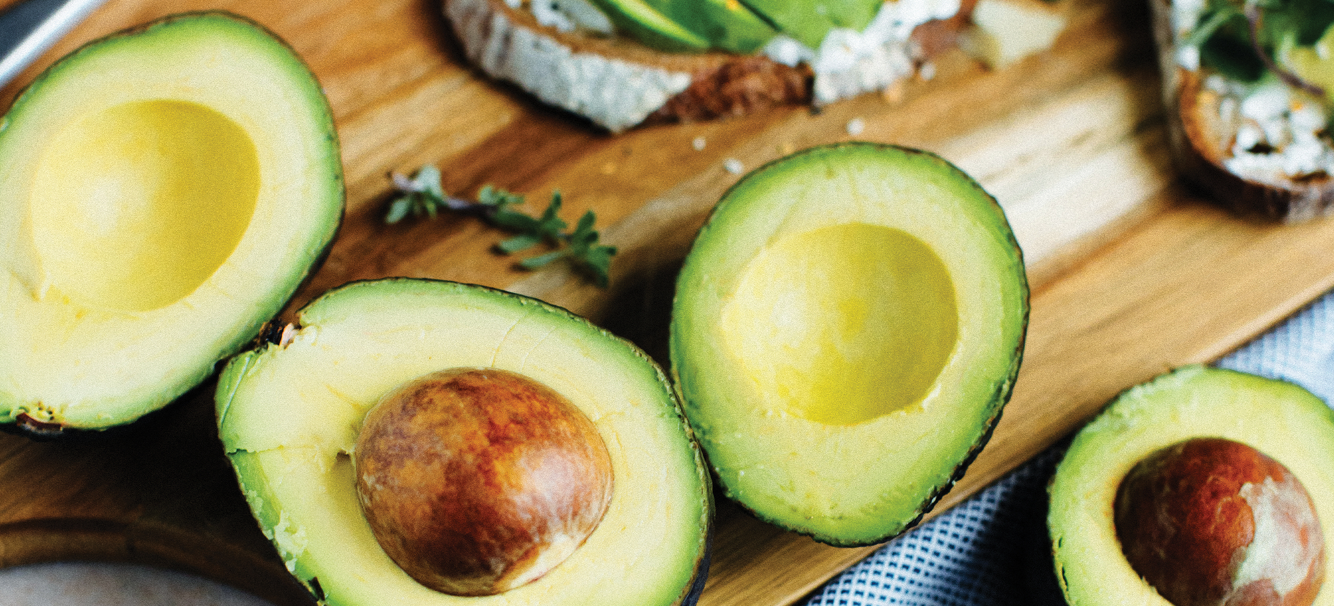 avocado sliced on a cutting board