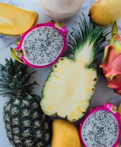 sliced tropical fruit displayed on a table  