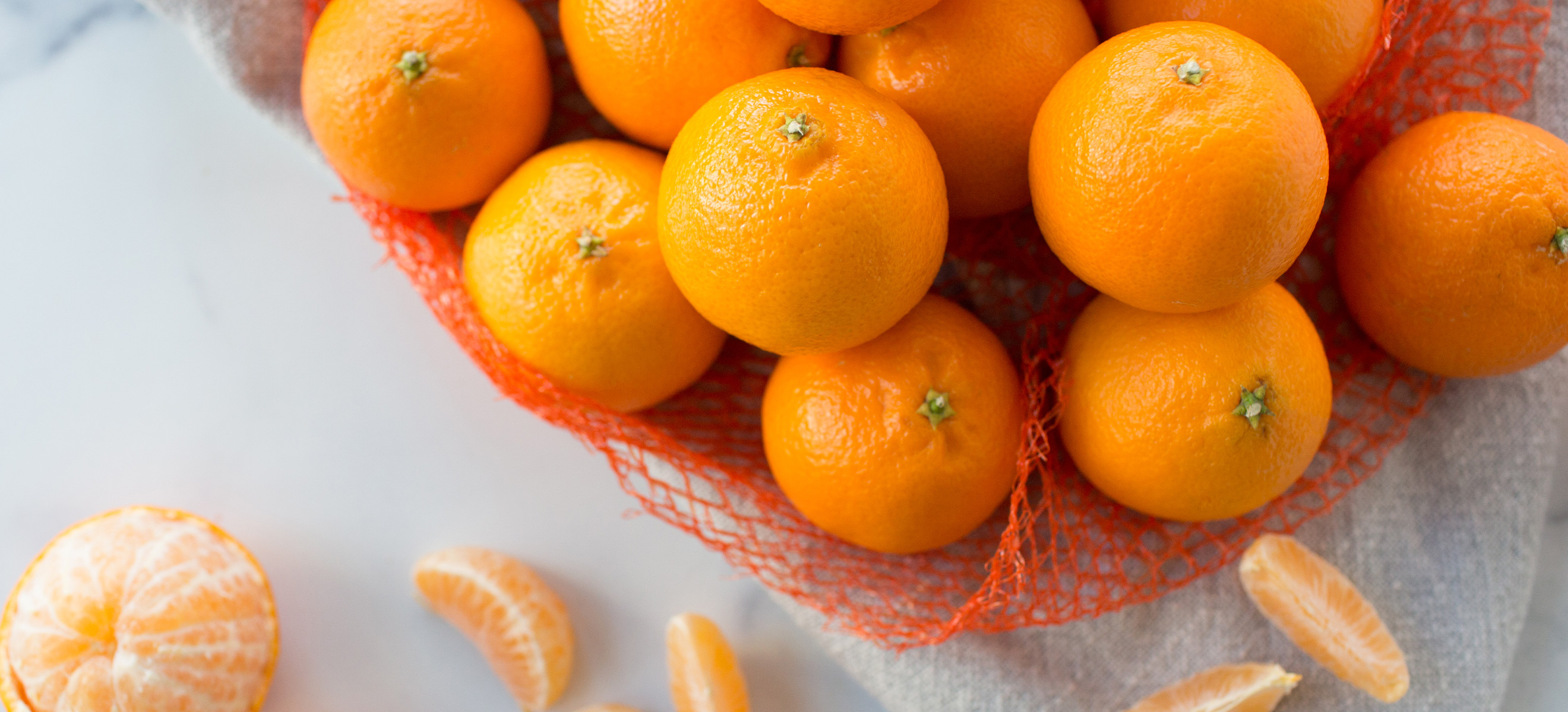 bagged mandarins on counter 