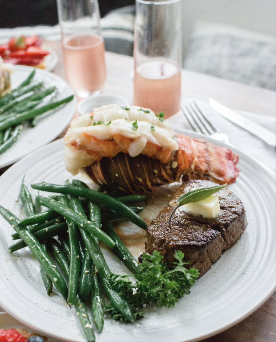 lobster and filet mignon on a plate